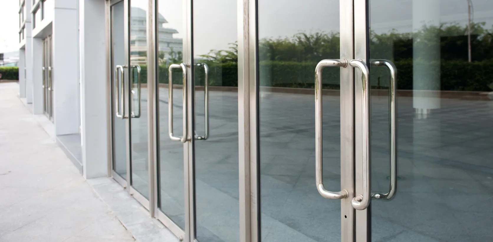 Glass entrance of a clean commercial office building
