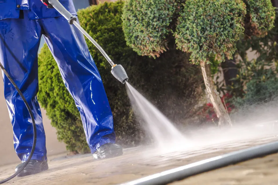 Pressure washing a stone patio